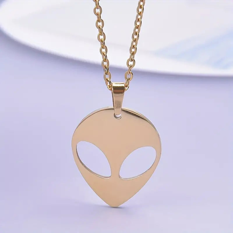 Unearth Extraterrestrial Elegance: Our Stylish Stainless Steel Alien Pendant Necklace - Available in both Silver and Gold Tones Options